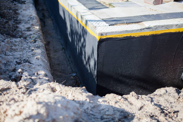Professional Waterproofing technician working in Hatley, WI